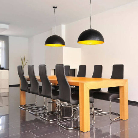 Forchini pendant light PD-1 round black/gold E27 max. 40W above a modern dining table with black chairs.