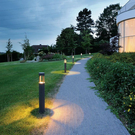SlotS 300 floor lamp anthracite 7W LED warm white, outdoor area, indirect warm white light on a garden path.