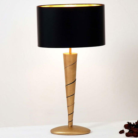 Table lamp Innovazione iron gold with modern design and black lampshade.