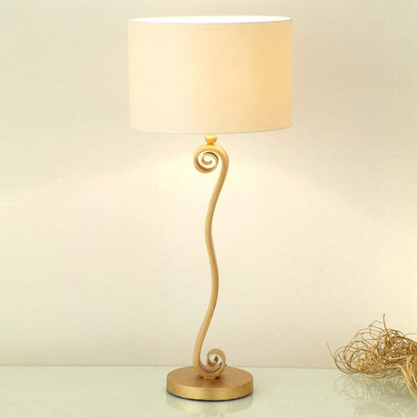 Table lamp Trofeo Iron Gold with elegant spiral design and light lampshade.