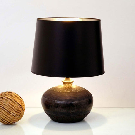 Melissa ceramic table lamp in black-grey-silver with a black lampshade and gold base.