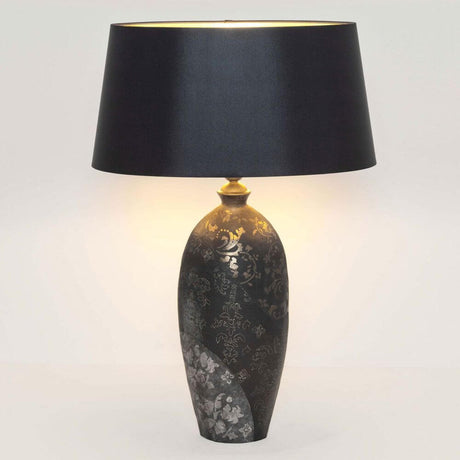 Table lamp Mary Oval Large Ceramic Black-Gold-Silver with elegant lampshade in black.