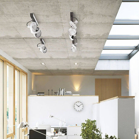 Track 5-light spotlight rail 150cm anthracite, modern lighting solution in a stylish room with a concrete ceiling.