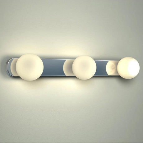 Azos mirror wall light 44cm IP44 Chrome, white mounted on a wall with three illuminated lamps.