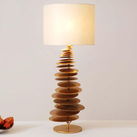 Table lamp Routatorre Mobile Iron Gold-Beige with stylish, modern design and a gold-colored, round lamp.