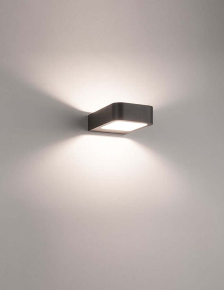 Acqua LED outdoor wall light 3000K dark grey IP54 on a wall with soft light.