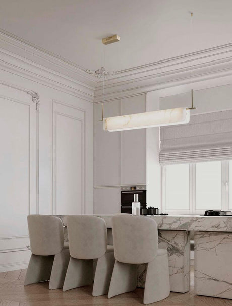 Aider pendant light 3000K above an elegant dining table in a modern interior.