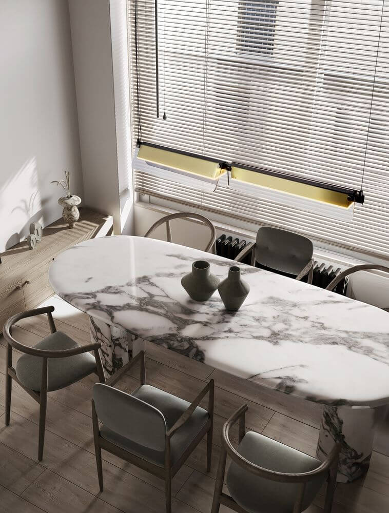 Apnea LED Pendelleuchte 3000K über einem eleganten Esstisch mit Marmortischplatte und modernen Stühlen.