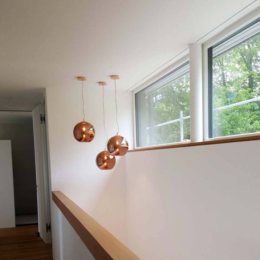 Argento Glas Hängelampe Ø 20cm Kupfer in modernem Wohnraum mit natürlichem Licht