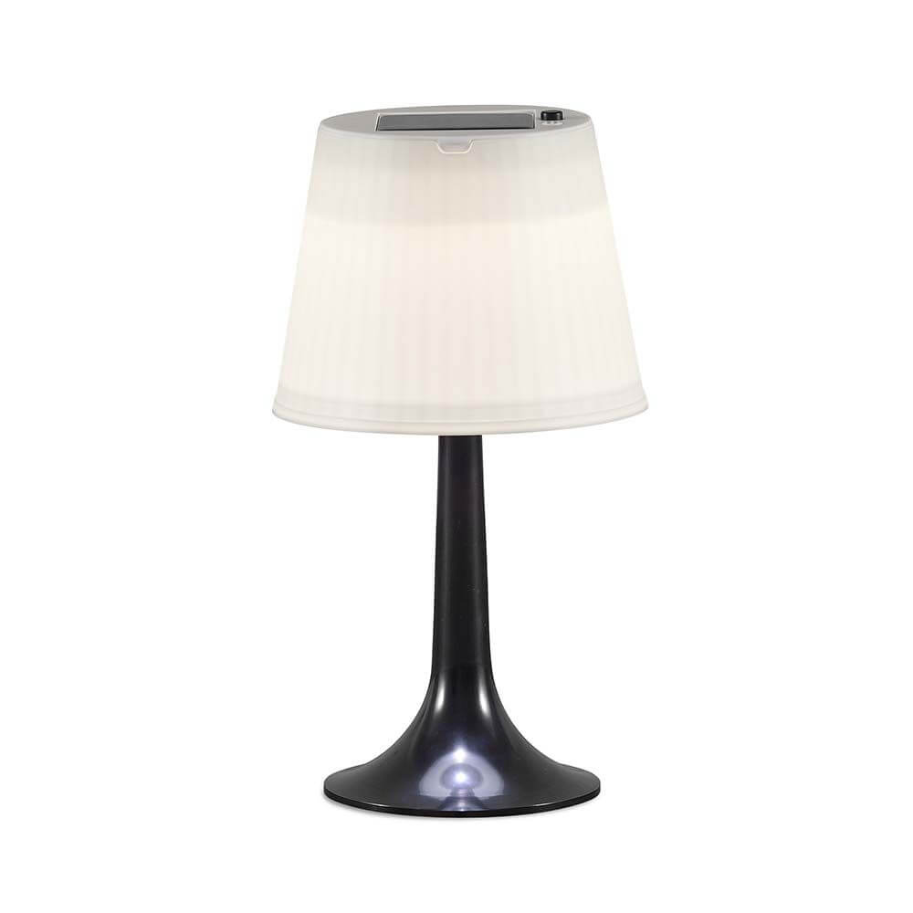 LED Tischlampe Assisi Schwarz auf einem Tisch, modernes Design ideal für Garten oder Terrasse.