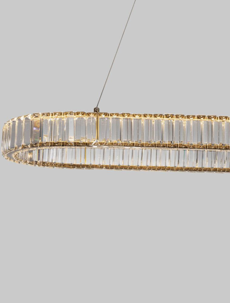Aurelia LED Pendelleuchte 3500K mit goldfarbenem Metallgestell und massiven Glasstäben