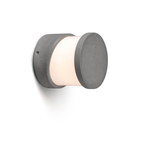 Außenwandleuchte BLOCK IP65 Zementgrau mit ovalem Design aus Zement und warmem Lichtstrahl für Gärten und Terrassen.
