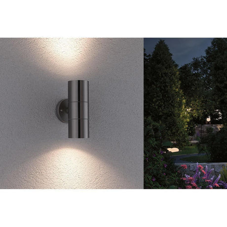Flame outdoor wall light 2-light brushed stainless steel on a wall, creating indirect light accents outdoors.