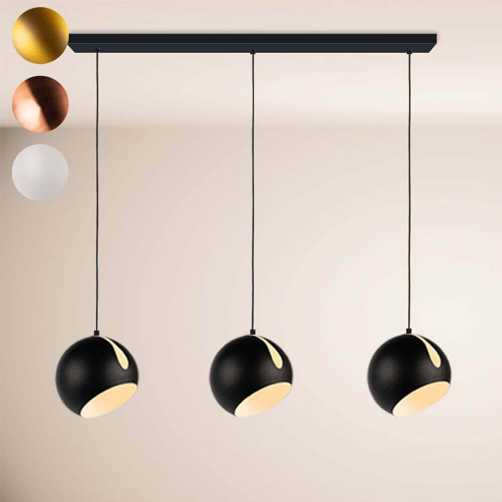 s.luce Ball Pendelleuchte mit drei schwarzen Kugeln, hängend über einem Tisch, moderne Lichtlösung für Esszimmer.