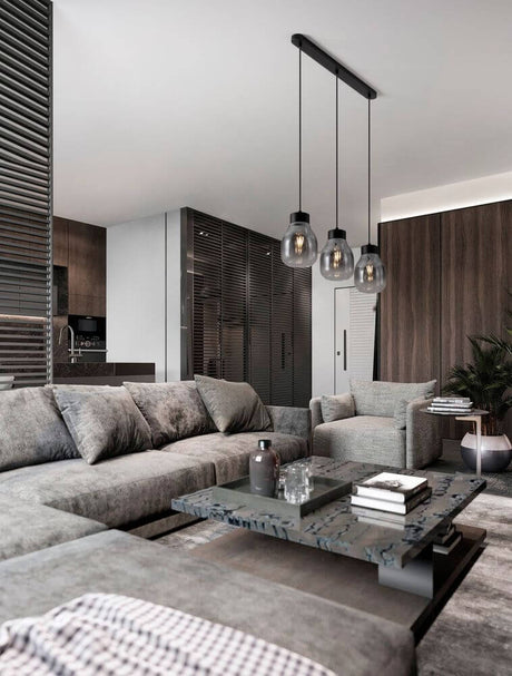 Blacu 3-light pendant light Black in a modern dining area with stylish interior and a cozy atmosphere.