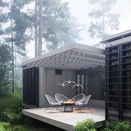Brokis pendant light Night Birds vertical wings 61 cm in a modern outdoor area with wooden terrace and garden furniture
