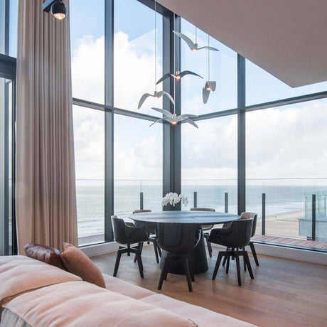 Brokis pendant light Night Birds horizontal wings 78cm in a modern living environment with sea view.