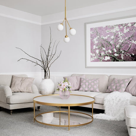 Living room with ceiling light 3Some 3-light antique gold, round table and elegant furniture.
