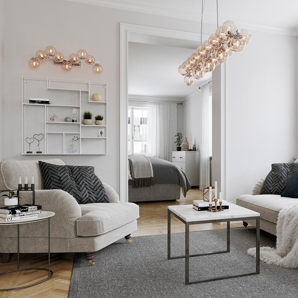 Pendellampe Splendor Bar 124 cm i en moderne stue med elegante møbler og nøytral fargepalett.