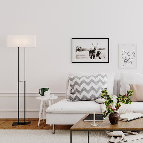 Luton floor lamp white in a modern living room with a stylish sofa and decorative elements.