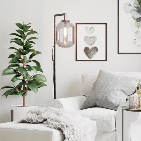 Floor lamp Leola smoked glass shade in a modern living space with gray-green accents and decorative pictures.