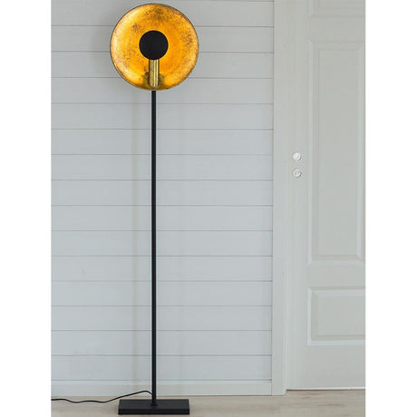 Captain floor lamp direct or indirect black gold-colored with a warm light glow and modern design.