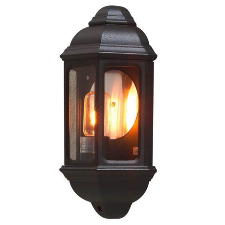 Zewnętrzna lampa ścienna Cagliari, czarna, z przezroczystego szkła, z ciepłym światłem i eleganckim designem.