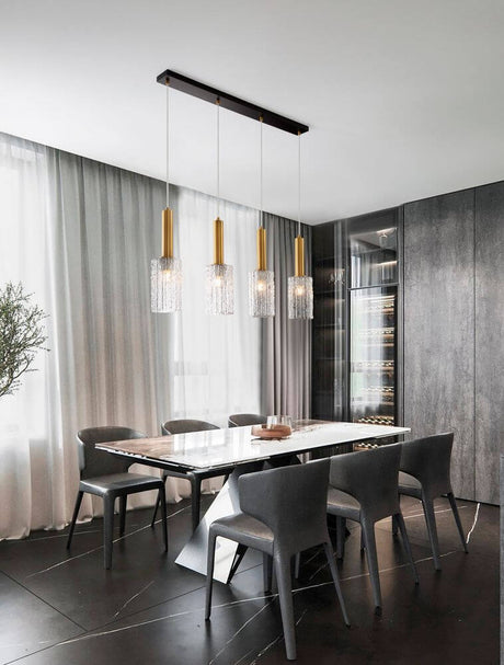 Certa 4-light pendant light Black, Gold above an elegant dining table in a modern interior.