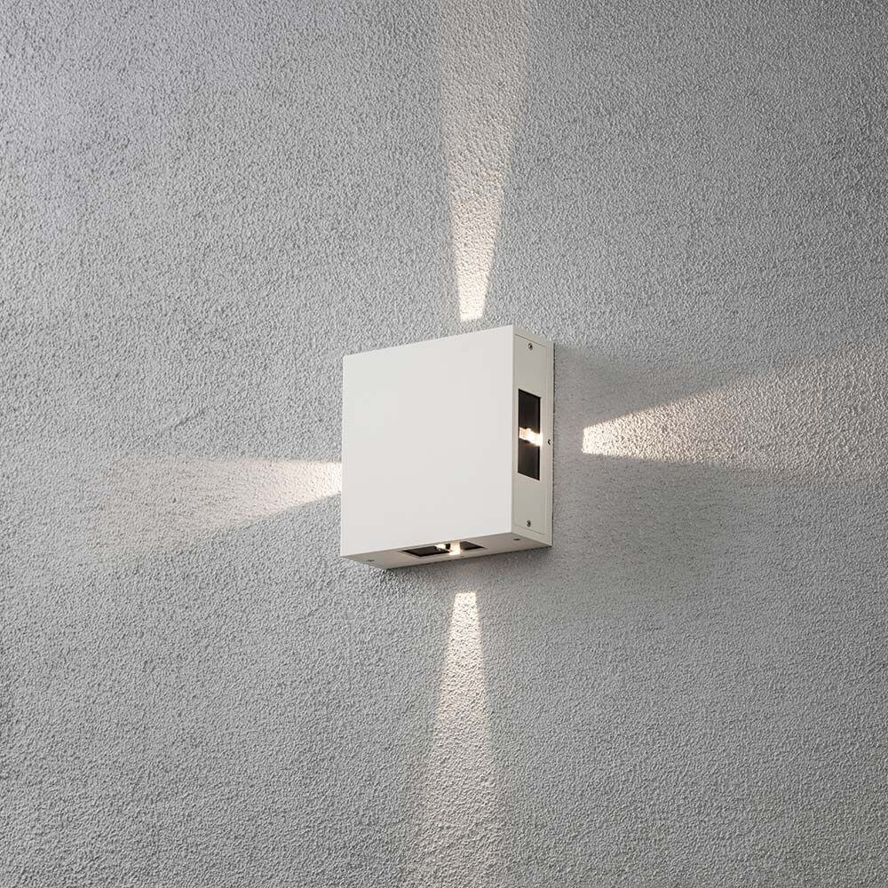 Cremona LED Außen-Wandleuchte 4er-Lichtstrahl einstellbar Weiß an einer Wand installiert, schematisches Lichtmuster.