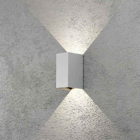 LED Cremona outdoor wall light with adjustable light output in grey, installed on a grey wall.