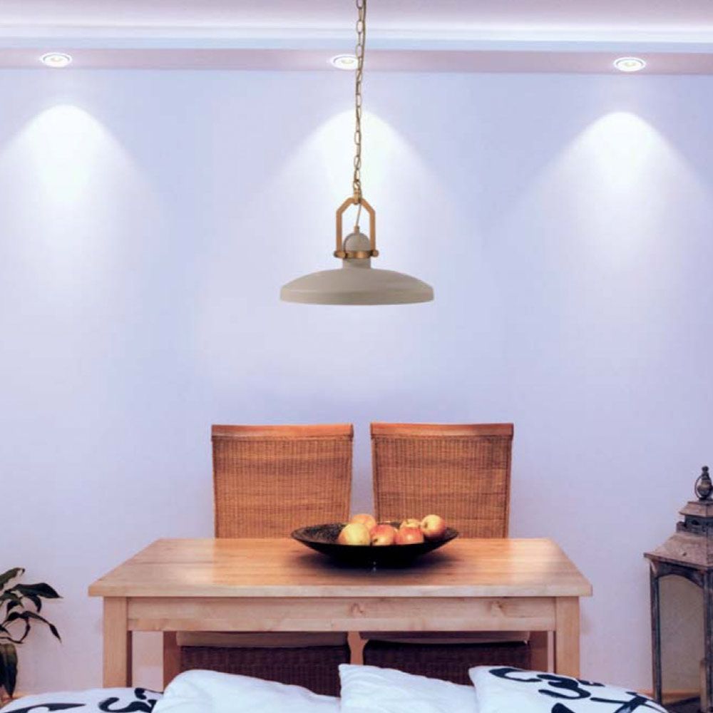 Cyg lámpara colgante de hormigón Ø 40cm en estilo industrial sobre una mesa con luz tenue.