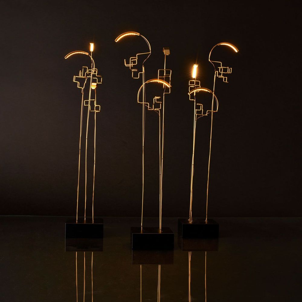 DCWéditions Boucle LED Akku Tischlampe schwarz Gold - moderne Designlampen in einem stilvollen Raum