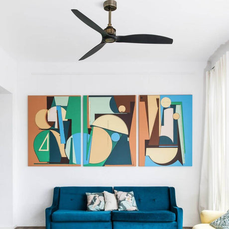 Just Fan ceiling fan Ø 128 cm above a modern sofa, stylish wall art in the background.