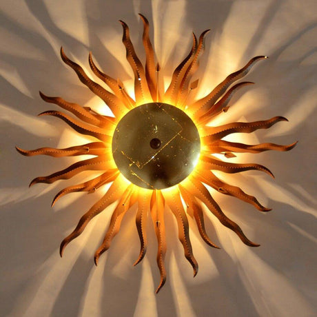 s.luce Diator L sol forjado a mano en colores óxido y dorado con efectos de luz fascinantes