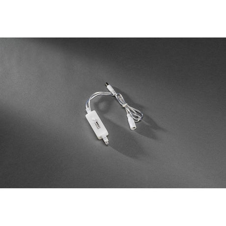 Dimmer for LED lights with transformer up to max. 400 LEDs, transparent cable connection on a dark background.