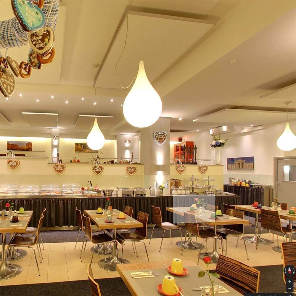 Drop-2L Pendelleuchte Ø 36cm Liquid-Light Weiß im stilvollen Restaurant mit eleganter Einrichtung
