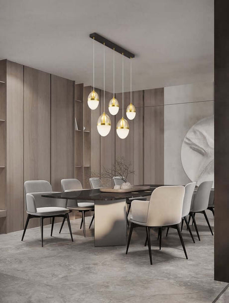 Egna pendant light 5-light bar 3000K gold above an elegant dining room with modern furniture.