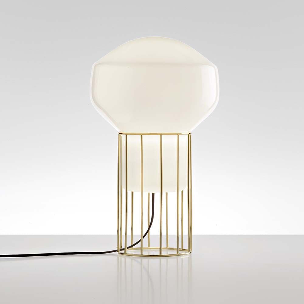 Fabbian Aérostat Tischleuchte Ø 11cm mit glänzendem Glasdiffusor und metallischem Rahmen in dunkelgrau und Messing.