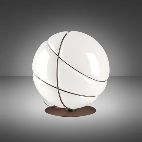 Fabbian Armilla table lamp, burnished, with glossy white glass and polished metal rings.