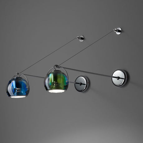 Fabbian Beluga wall light with crystal diffusers in various colors, ideal for bathrooms or bedrooms.