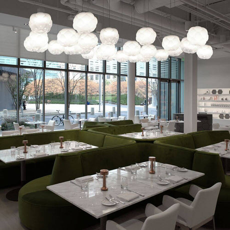 Fabbian Cloudy pendant light Ø 26 cm in an elegant restaurant with modern furnishings and a stylish ambience.
