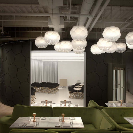 Fabbian Cloudy pendant light Ø 40 cm in a modern restaurant with creative lighting.