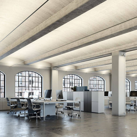 Fabbian Metro LED strip light 12 m in a modern office with stylish workstations and large windows.