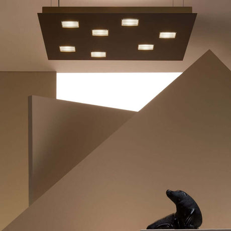 Fabbian Quarter LED square ceiling light 7-light in a modern setting with geometric shapes.