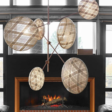 Forestier ceiling light Chanpen Structure 6-light above a fireplace, creating sparkling light accents.