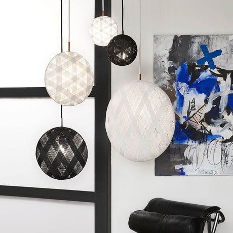 Forestier Chanpen Diamond pendant light in various sizes, elegantly suspended in a modern interior.