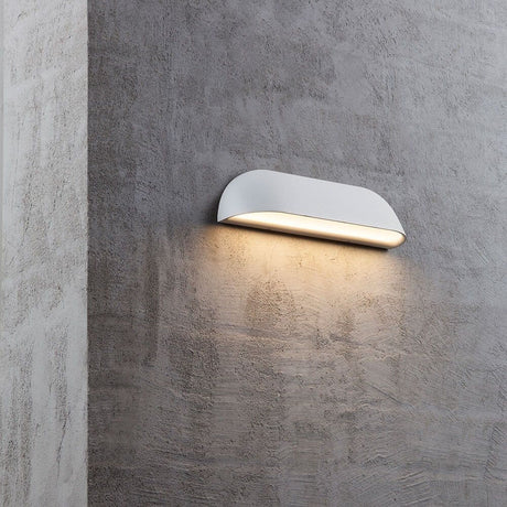 Front 26 LED wall outdoor lamp IP44 White on a wall, creates elegant outdoor lighting design.