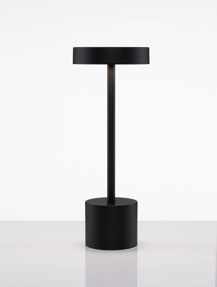 Fumo LED Außentischleuchte 3000K IP54 in elegantem schwarzem Design auf einem Tisch.