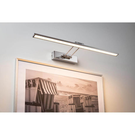 LED picture light Galeria Beam Sixty 11W chrome mounted above a work of art.