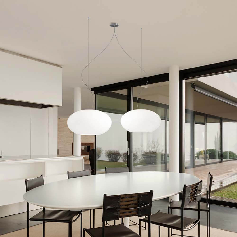 Casablanca Hängelampe AIH L 2-flammig über einem eleganten Esstisch im modernen Interieur.